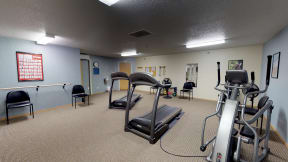 Fitness Center with Cardio Machines and Chairs