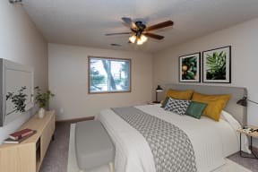 Bedroom with Bed, Dresser and Ceiling Fan