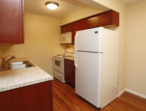 Bright kitchen featuring in unit microwave and dishwasher.