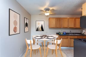 Kitchen with Wood Cabinets and Circular Dining Table