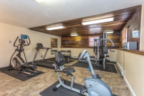 Fitness center furnished with a variety of cardio and strength training equipment.