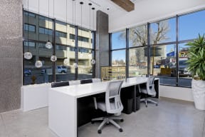 White conference table with chairs in Civic Lofts lobby