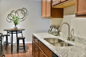 Kitchen featuring beautiful granite countertops and stainless steel fixtures.