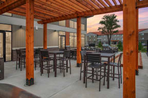 Outdoor deck with beautiful wood pergolas shading plenty of outdoor seating.