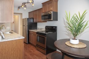 Bright kitchen with classic finishes and updated stainless steel appliances.