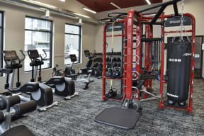 24 hour fitness center complete with a variety of cardio and weight training machines with ample natural light.