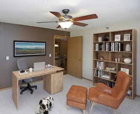 Spacious office for work from home with an accent wall.