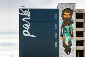 Parking Garage Exterior with Graphic Art, "Park" on The Walls