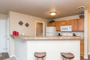 Bright kitchen features a large breakfast bar for casual dining and entertaining.