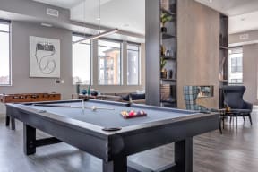 The gallery community space offers both a pool and foosball table all naturally lit with countless windows.