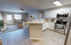 Renovated kitchens feature white cabinetry, stainless steel appliances, and open concept layout.
