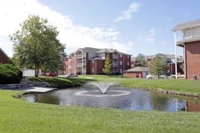 Serene view of the Lakeside fountain and lush landscaped grounds.