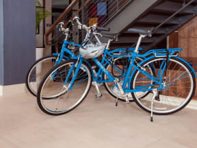 Two blue bicycles parked in MartinBlu lobby