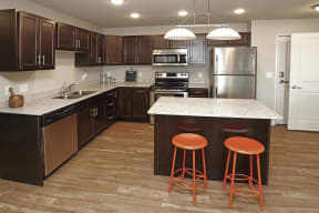 Full Kitchen with Island and Barstools