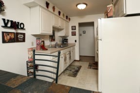 View of the comfortable kitchen that leads to the hallway opposite the dining room.