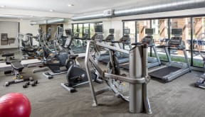 Spacious 24 hour fitness center with a variety of cardio and strength machines.