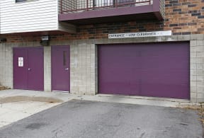 Outdoor view of parking garage, closed purple doors