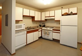 Kitchen with white cabinets, white appliances