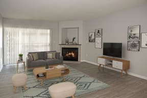 Furnished Living Room with Fireplace and Sliding Glass Door