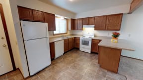 Full Kitchen with Wood Cabinets and Appliances