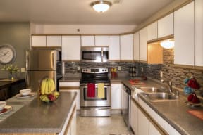 Full Kitchen with White Cabinets, Stainless Steel Appliances