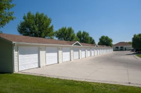 Large driveway with detached garage parking available.