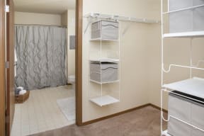 Master suite complete with spacious closets and storage leading into the private bathroom.