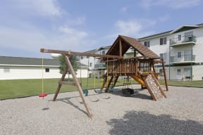 A community playground complete with swings for having fun outside.