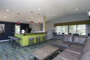 Community room with large windows and a kitchen for hosting gatherings.