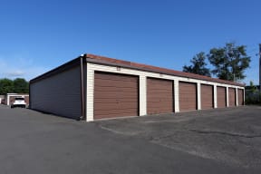 Detached garages with large driveways.