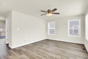 living room with hardwood floors and ceiling fan natural light  at Franklin Square Apartments/Townhomes, Pennsylvania, 17349