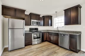mocha cabinets with granite hardwood floors stainless steel appliances