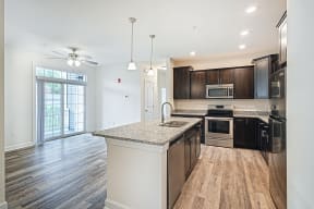 mocha cabinets with granite hardwood floors stainless steel appliances  at Franklin Square Apartments/Townhomes, Pennsylvania