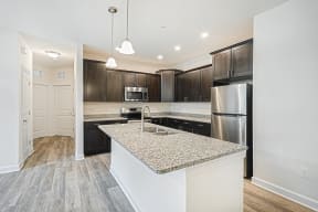 mocha cabinets with granite hardwood floors stainless steel appliances  at Franklin Square Apartments/Townhomes, New Freedom, PA, 17349