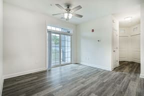 living room sliding door to balcony  at Franklin Square Apartments/Townhomes, New Freedom, 17349