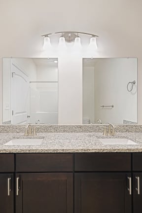 double sink mocha cabinets granite countertops  at Franklin Square Apartments/Townhomes, New Freedom, PA, 17349