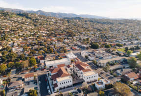Drone Shot of Plaza Riviera facing parking garages and view of the Riviera behind