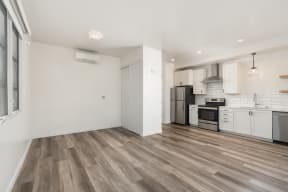 Interior Studio floorplan living area with view of kitchen