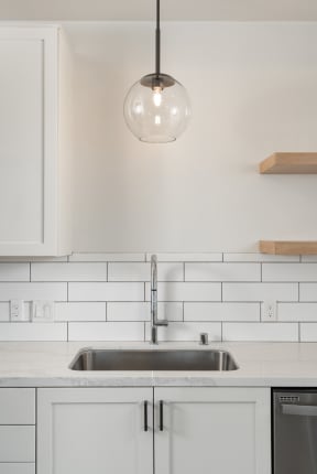 Kitchen sink with hanging pendan