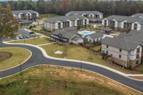 Aerial view of One White Oak apartment grounds and city view in Cumming, GA rentals
