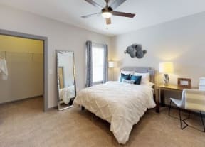 Furnished One White Oak bedroom with carpet flooring and medium window in Cumming, GA apartments