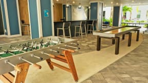 Clubhouse with hockey and foosball tables for Coda Orlando residents to use in Orlando, FL