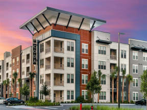 External view of Coda Orlando apartment rentals with spacious off-street parking spots in Orlando, FL