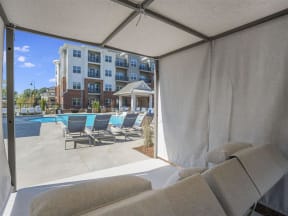 Lounge Swimming Pool With Cabana at Pointe at Prosperity Village Apartment Rentals in Charlotte, North Carolina