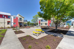 Outdoor Lounge Space Walking Path, Wood Chip Floor, Picnic Tables