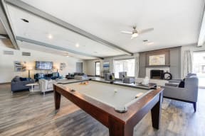 Clubhouse Sitting Area with Pool Table, Hardwood Inspired Floor, Gray and White Sofas