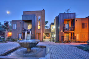  Community Outdoor Area with Stone Fountain, Stone Floor, and Full Moon