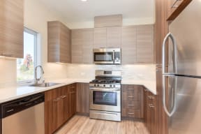  Kitchen with Hardwood Inspired Floors, Stainless Steel Fridge/Freezer. Dishwasher, Oven, Microwave