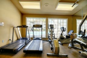 Fitness Center with Treadmills, Ellipticals, Weight Machines and Fluorescent Lights
