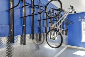 Community bike storage room which was designed for residents to have a secure room to store bikes without having to haul upstairs and leave on patios/balconies.  